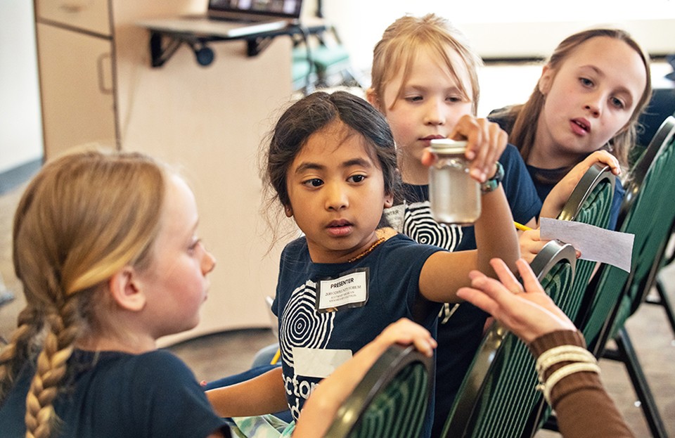 Young students participate in a hands-on, STEM-based activity.