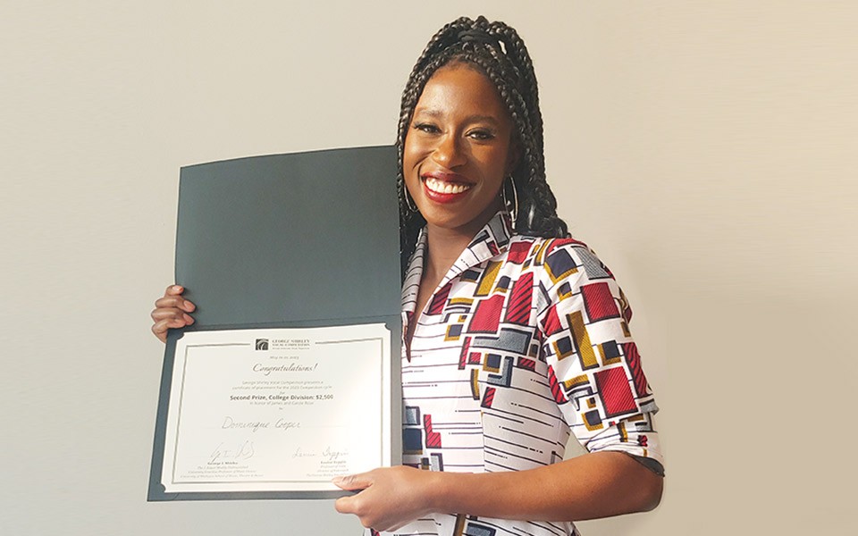 Dominique Cooper displays her second-place-winning vocal competition certificate.
