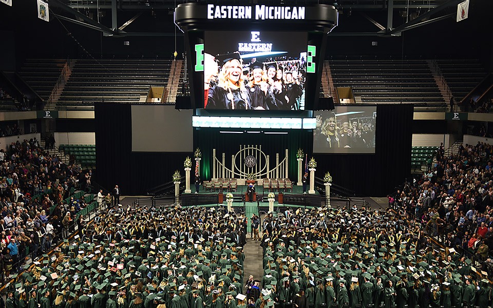 An overhead view of the stage at the George Gervin GameAbove Center during a commencement ceremony.