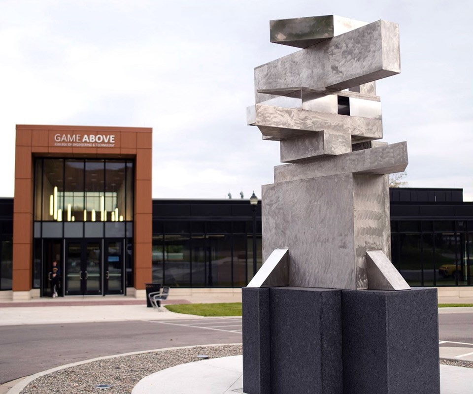 A new sculpture by Benjamin Victor titled, "Engineered Technology"  outside the GameAbove College of Engineering and Technology