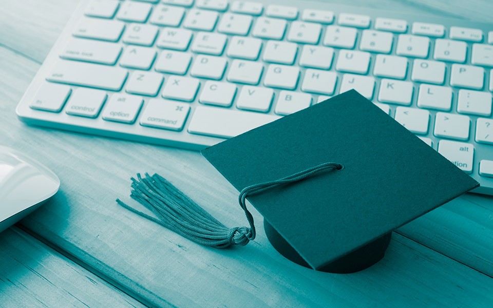 Representative photo of a mortarboard on a keyboard