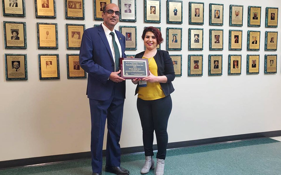 Vijay Mannari and NeDa Hayeri with her award.