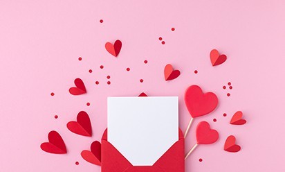 a red envelope opens to reveal a blank card with red hearts all around