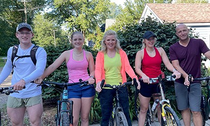 The Crumm family, from left to right: Phillip, Evelynne, Michelle, Isabelle, and Aaron Crumm head out for a bike ride.