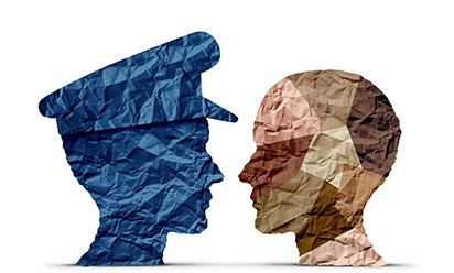 illustration of police and a multi-racial civilian in profile using crumbled paper texture