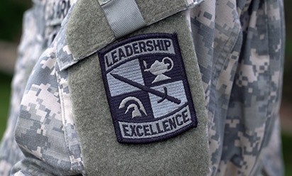 Close up view of ROTC uniform with a Leadership and Excellence arm patch