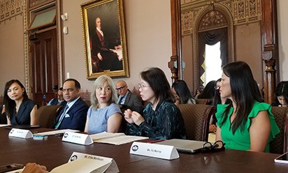 Tsu-Yin Wu speaks at a roundtable discussion at the White House.