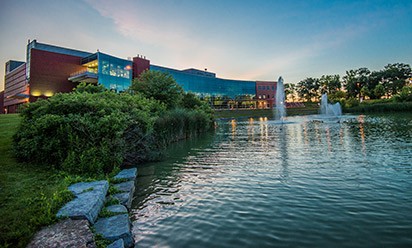 The Student Center and pond at dusk