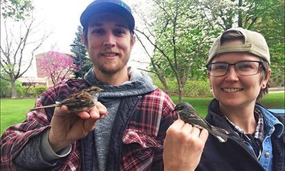 Kenneth Glynn and Dorothy Zahor holding little robins