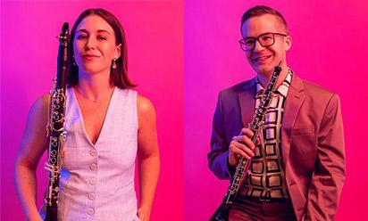 Kari Landry and Tim Gocklin posing with their instruments against a bright pink background