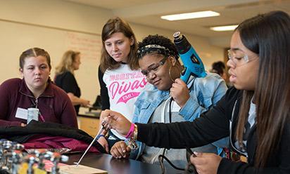 Girls work on a project at the Digital Divas event.