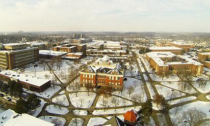 A snowy aerial view of campus in the winter.