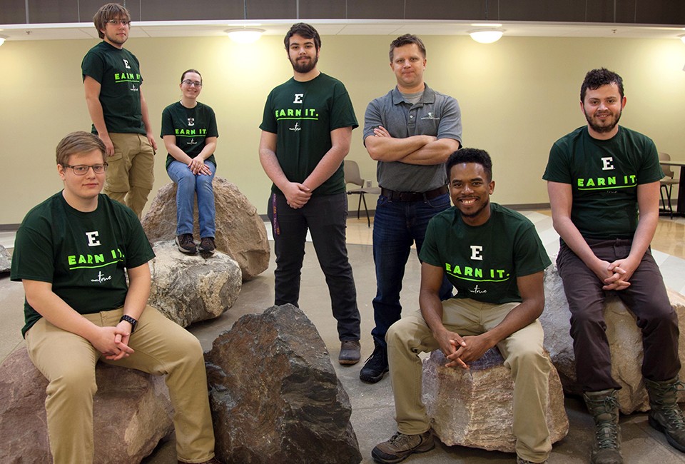A team of EMU physics students pose on the rocks at Mark Jefferson Science Center.