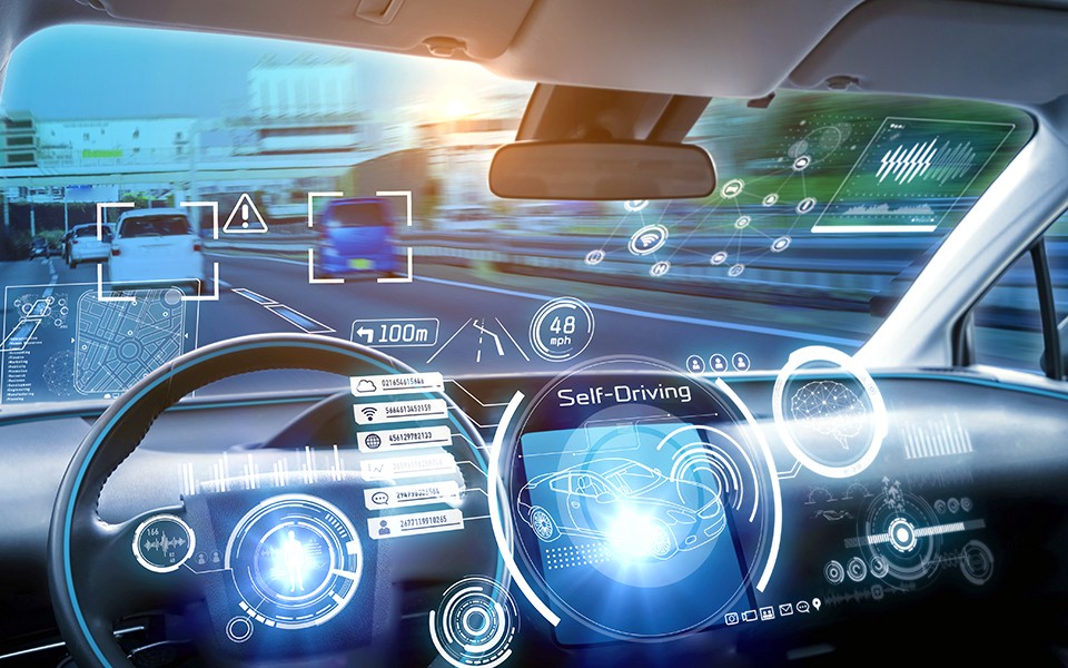 Photo illustration of the inside of an autonomous vehicle with computer messages in lights.