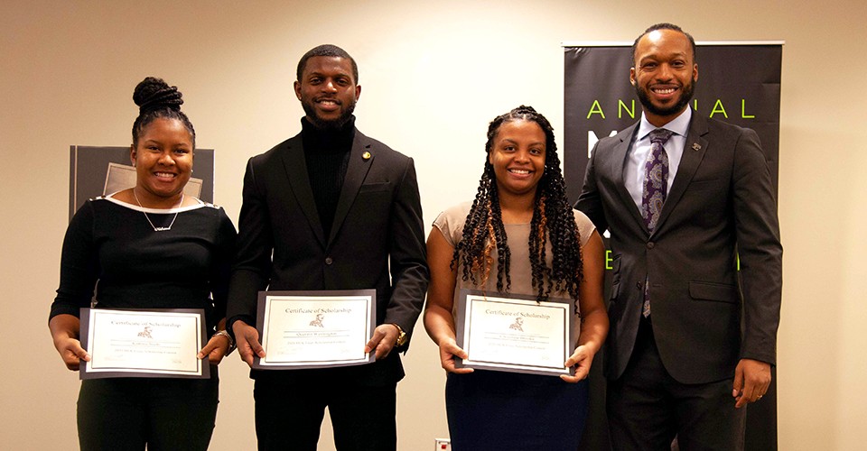 From left: Katrina Seals, Quentin Washington and Chocolate Brooks, essay contest winners with Eric Reed, Director of TRIO.