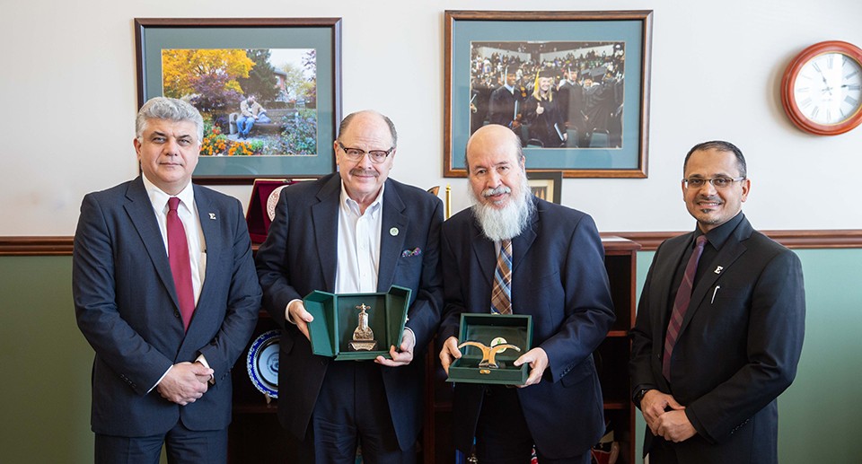 From Left to right: Dean Mohamad Qatu, President Jim Smith, Mohamad Fatani, King Abdulaziz University, Saeed Bahidra, recent EMU Ph.D. graduate