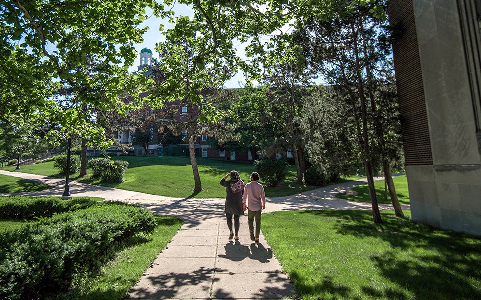 A couple walking on campus