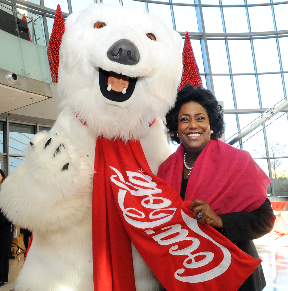 Ingrid Saunders Jones with the Coca-Cola Company's bear mascot