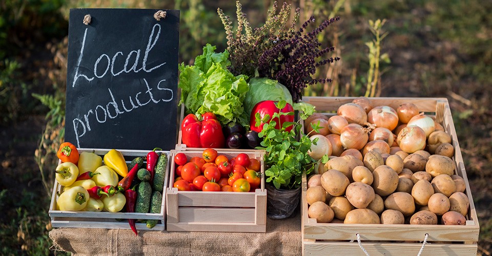 farm fresh fruits and vegetables with "Local products" sign