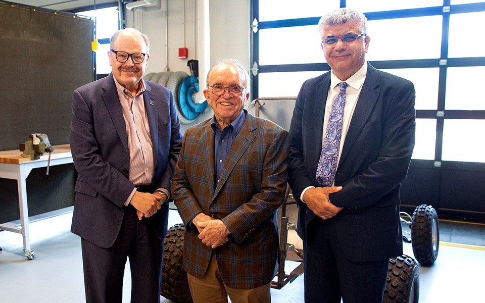 President Jim Smith, Jack E. Roush, and Dean Mohamad Qatu in the engineering lab
