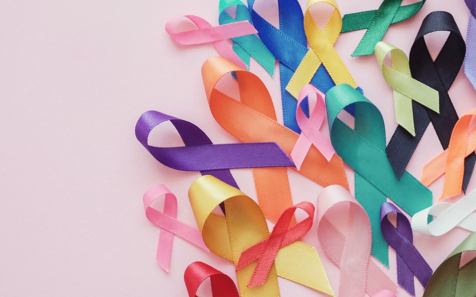 A collage of cancer ribbons in various colors