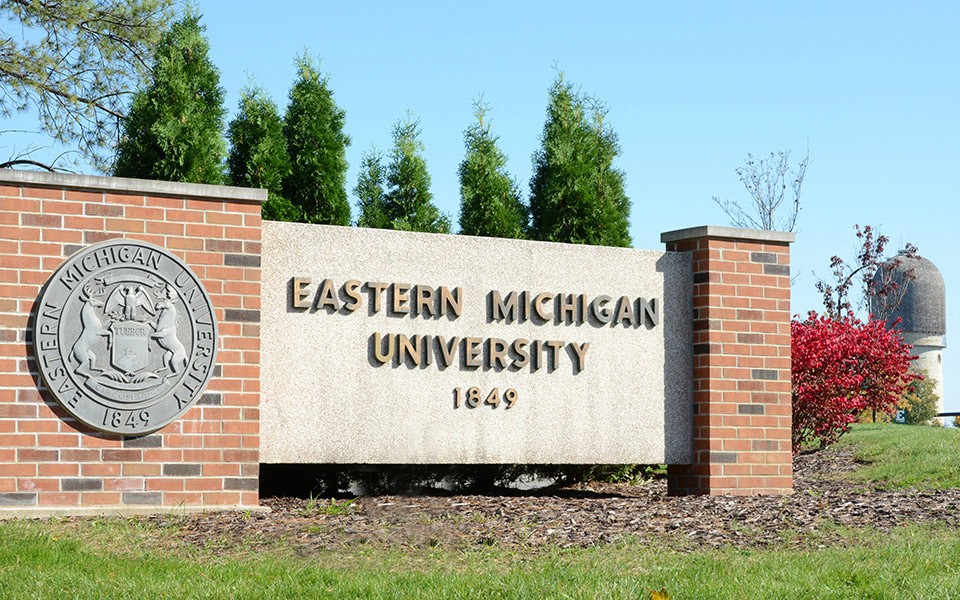 EMU campus sign with University seal