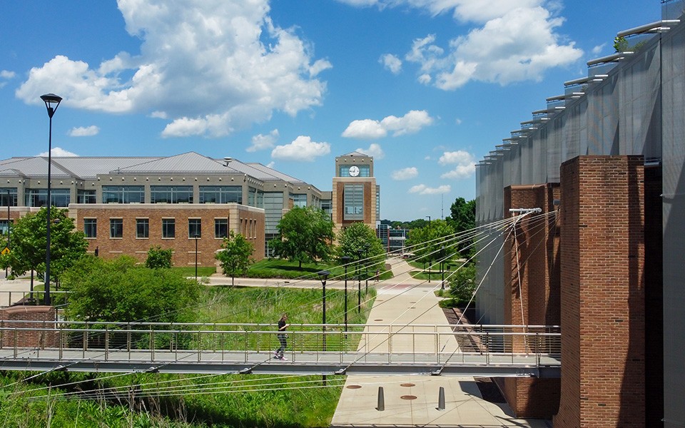 An elevated view of the Science Complex bridge and Hall Library, looking toward the Student Center.