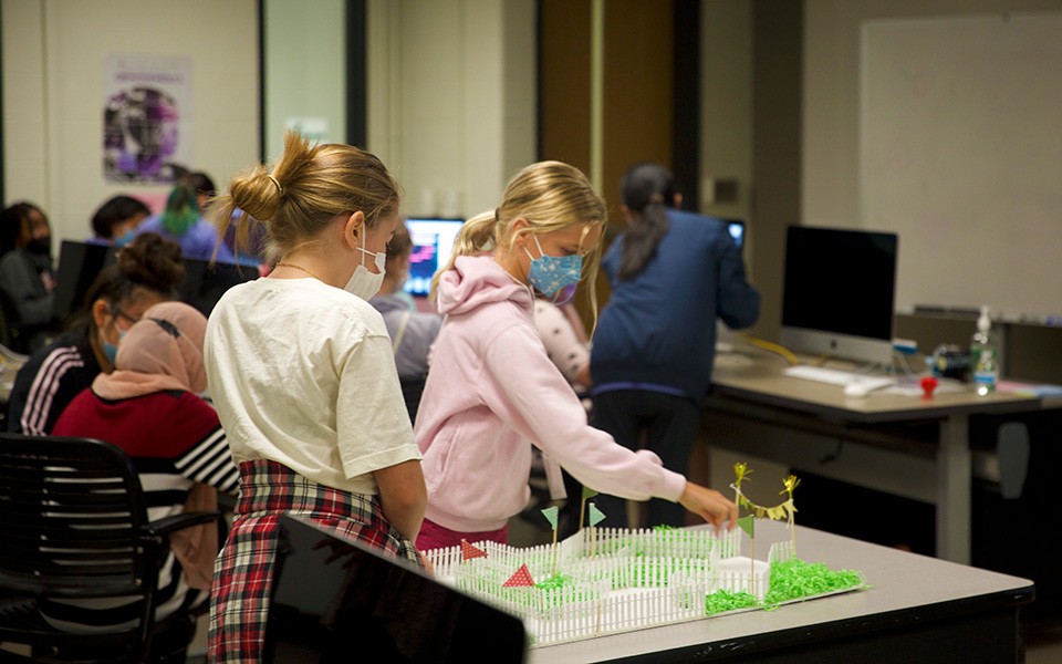 Young girls participate in a summer camp in computer science at EMU.