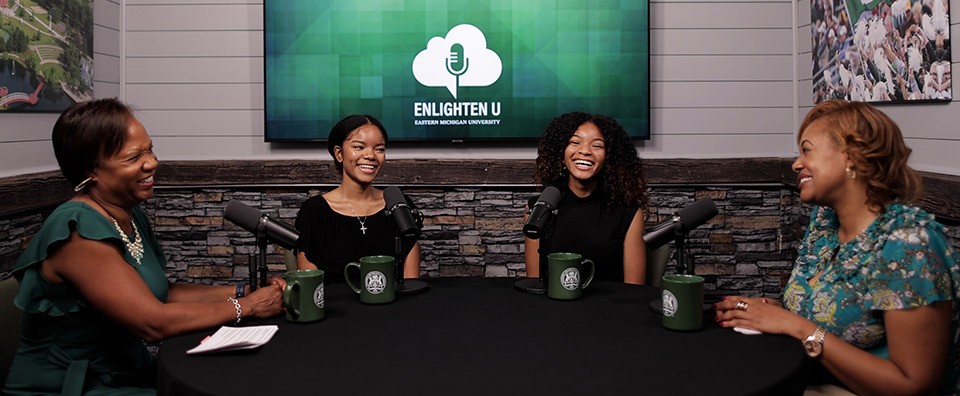 Lolita Cummings, Jessica and Jaida Turner, and Melissa Thrasher seated around the table of the Enlighten U podcast set.