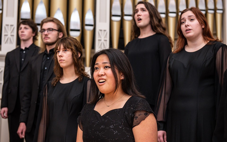 EMU Choir students wearing black dress clothes perform at Pease Auditorium.
