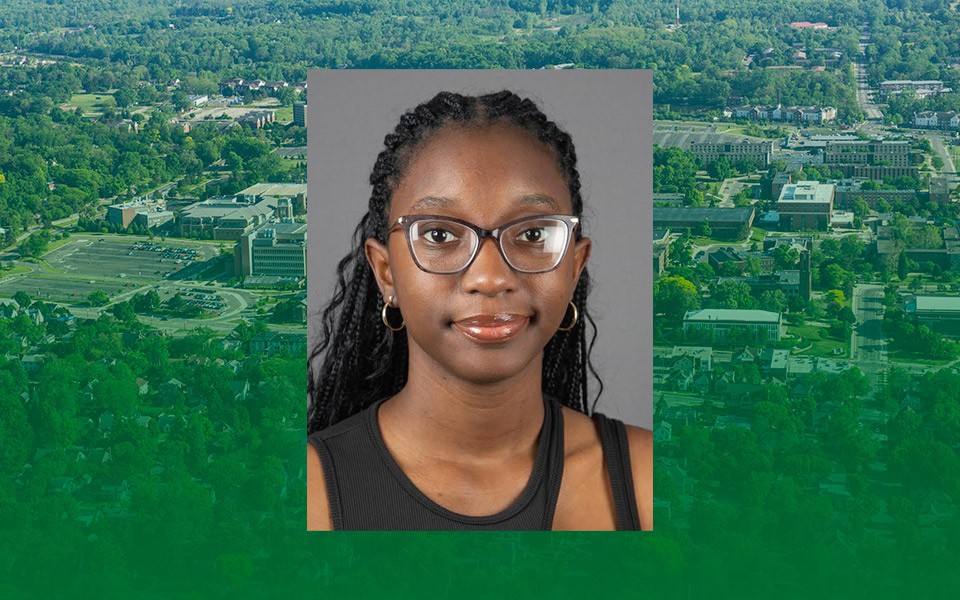 Anyah Johnson's headshot on an aerial photo of campus with a green transparent overlay.