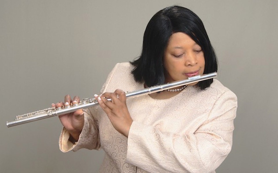 Sherry Young plays the flute.