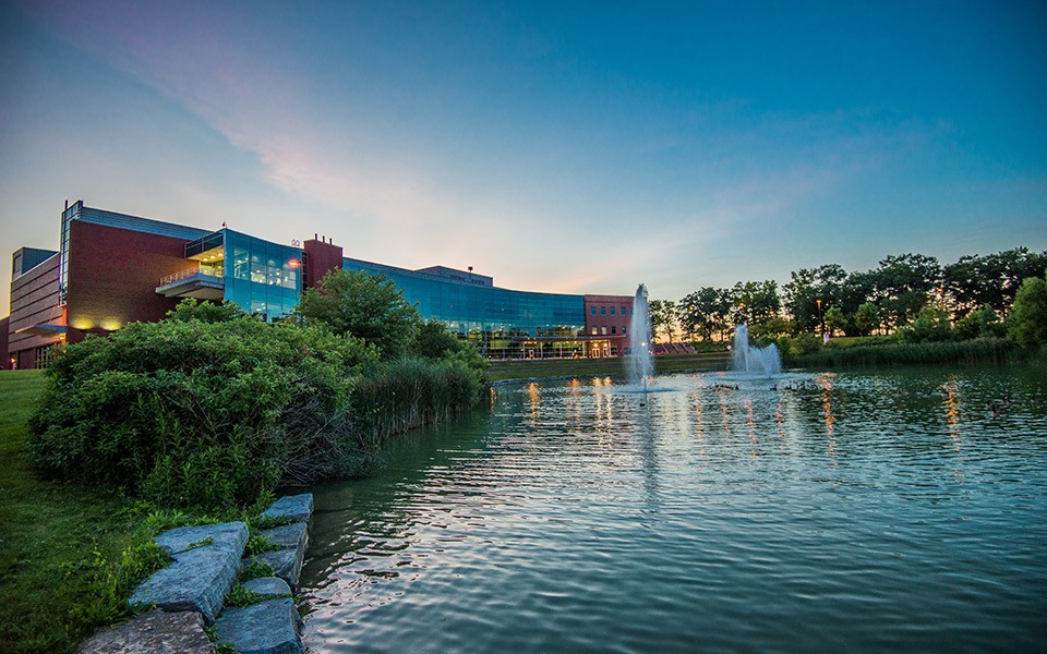 The Student Center and pond at dusk