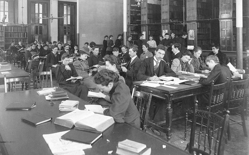 Archival photo of students in Old Main library.