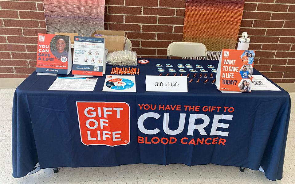 The Gift of Life sign-up table with swag and info for potential donors.