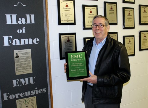 Dennis Beagen holds his EMU Forensics Distinguished Leadership Award in 2012