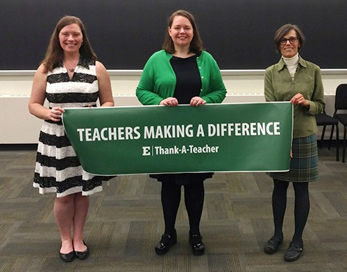 participants hold event banner
