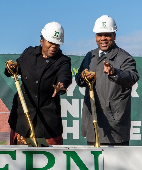Regents Dr. Jessie Kimbrough Marshall and Nathan Ford hoist golden shovels at the groundbreaking