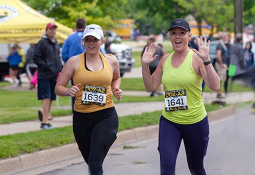 Isabelle and Michelle Crumm in a half marathon